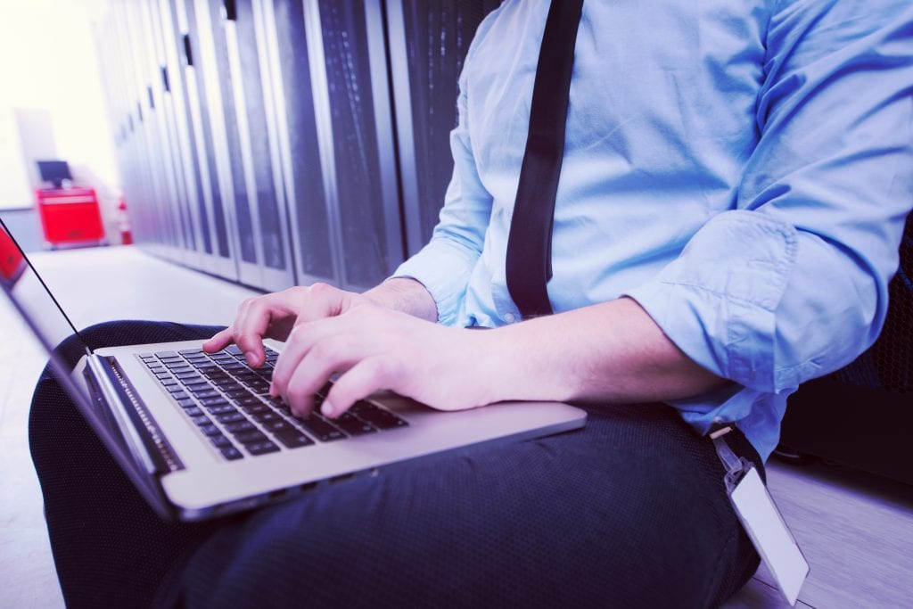 photo of IT engineer at modern data center