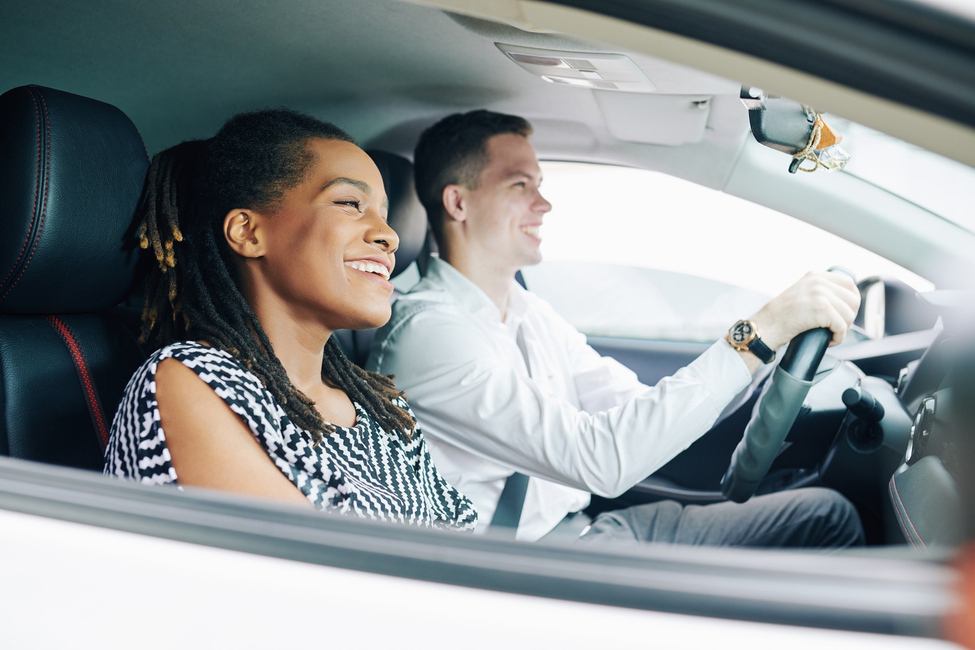 Multiethnic couple driving