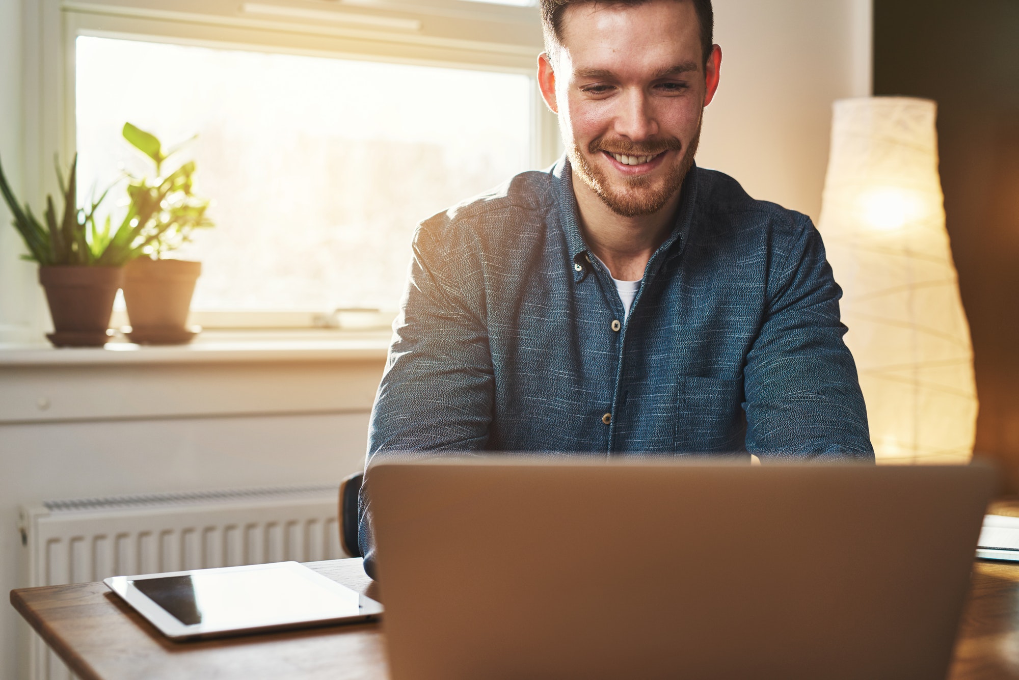 Smiling business entrepreneur in his office
